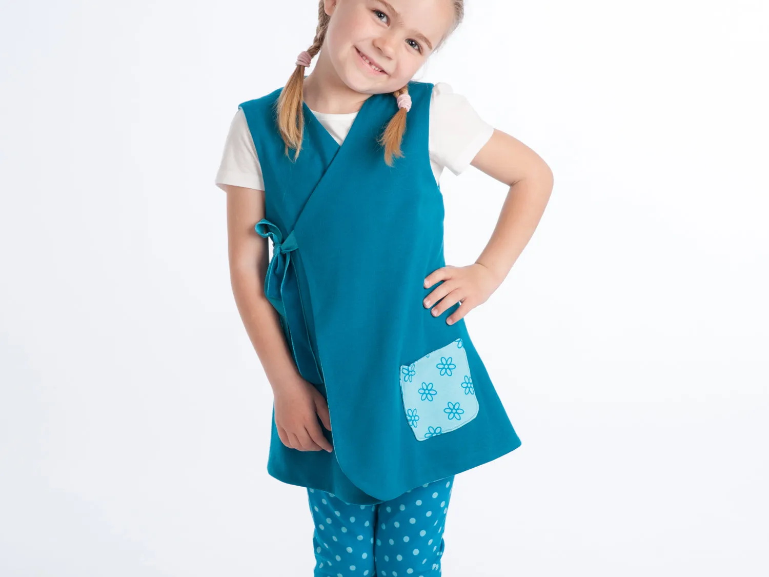 Lined baby tunic wrap dress pattern for girls. Easy sewing reversible dress with or without sleeves. Paper pattern MARIE by Patternforkids