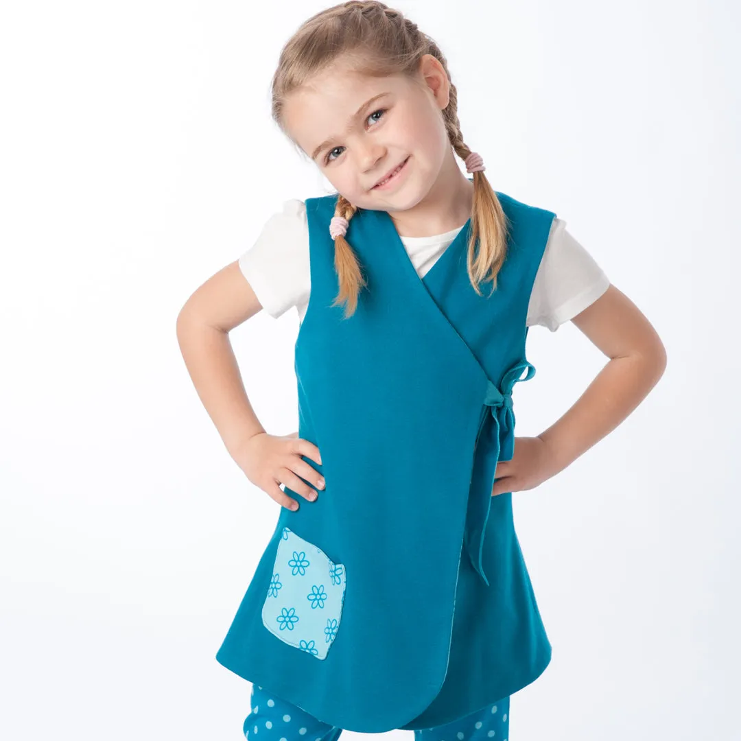 Lined baby tunic wrap dress pattern for girls. Easy sewing reversible dress with or without sleeves. Paper pattern MARIE by Patternforkids